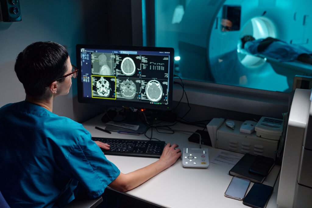 doctor examining patient's mri scans in hospital room